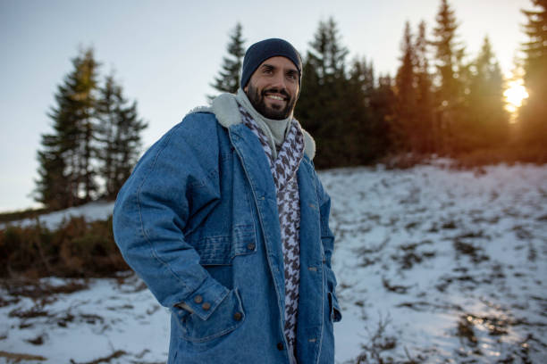 istock A handsome man enjoys a walk on the first snow 1288711623