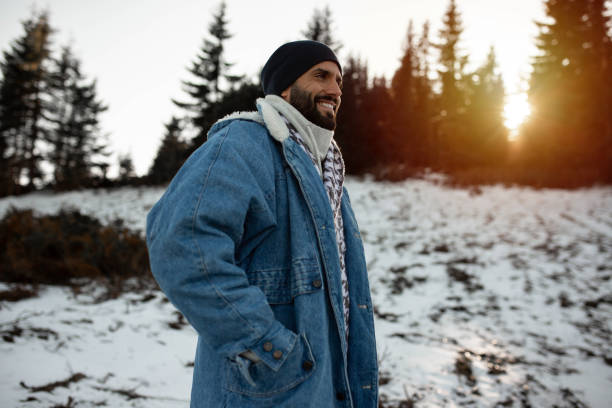 istock A handsome man enjoys a walk on the first snow 1288711753