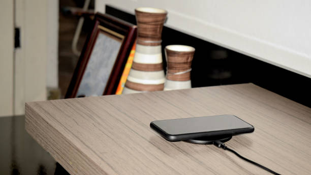istock Cellphone charging in a wireless charger 1288715467