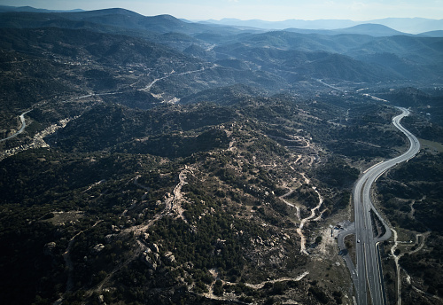 Drone shooting highways between the mountains