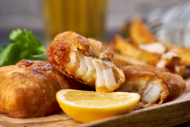 Fish and chips with lemon close-up stock photo