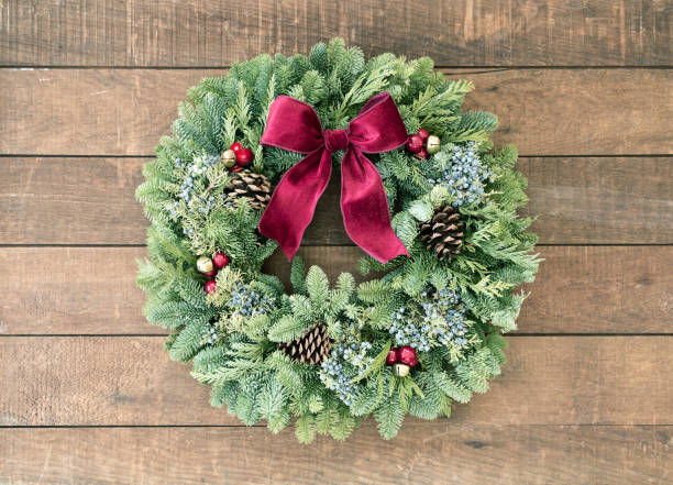istock Christmas wreath on an old wood background 1288722989