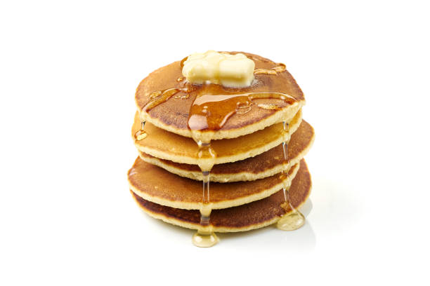 istock Stack of pancakes with butter and honey on white 1288723887