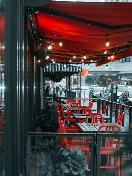 Empty outdoor resteraunt tables in city