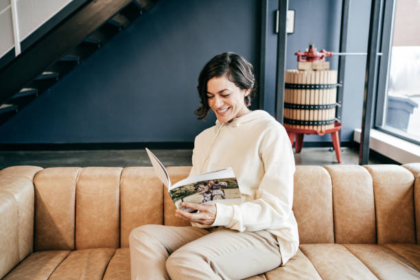 istock Women sitting on sofa and read a book 1288730601