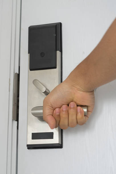 istock A man opening electronic door in hotel room. 1288732064