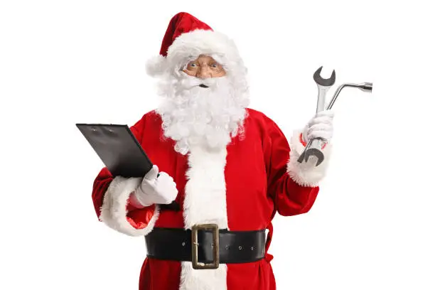 Santa Claus holding a clipboard and car repair tools isolated on white background
