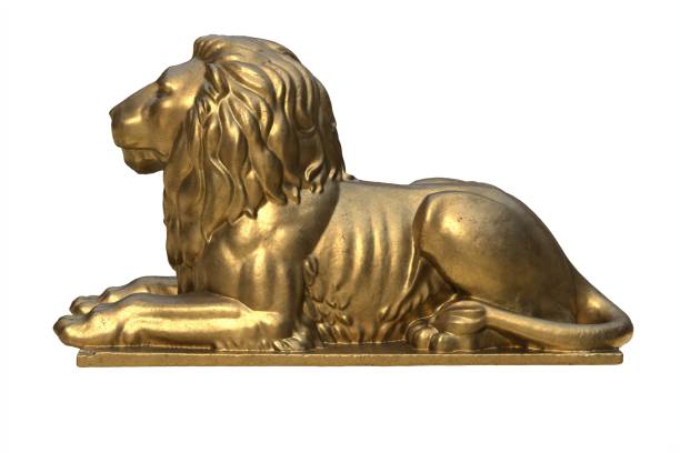 istock 3D render of lying lion gold sculpture isolated on white 1288746088