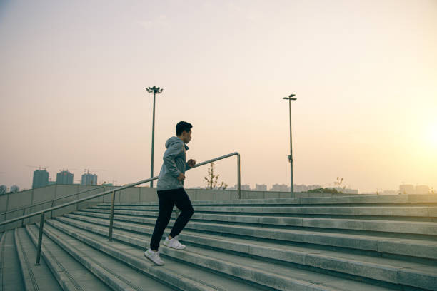 istock Man running up stair in the morning 1288755333