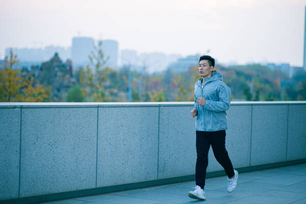 istock Young man running outdoors 1288755339