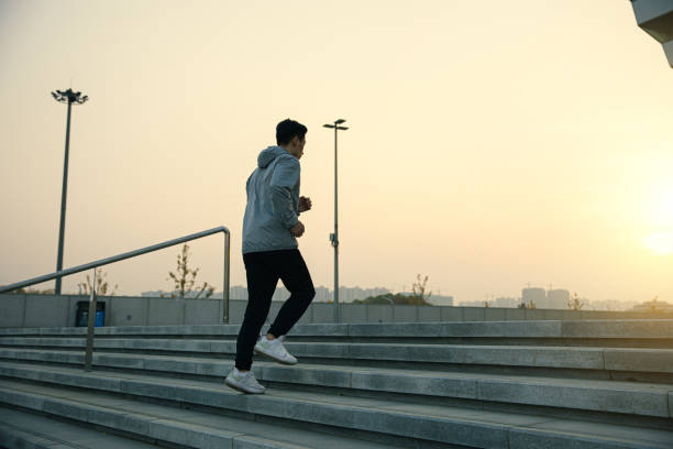 istock Man running up stair in the morning 1288755365