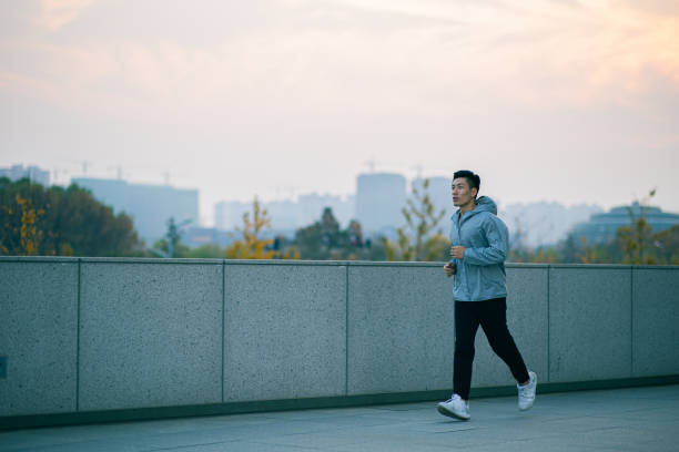 istock Young man running outdoors 1288755387