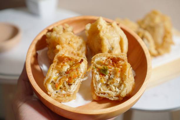 istock spicy fried tofu on hand clean shot 1288758645