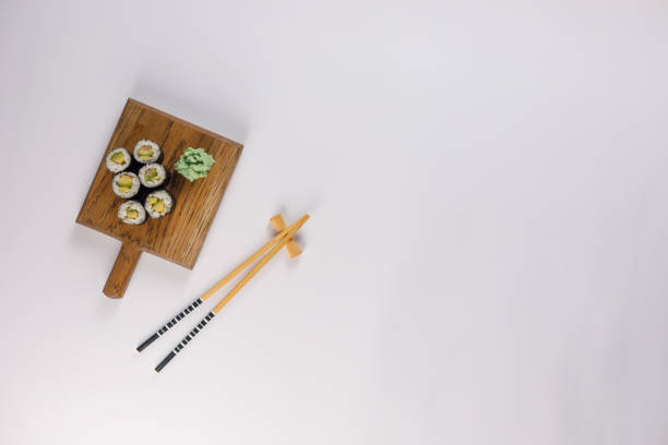 Appetizing rolls on a white background. Japanese food concept. Close-up. Copy space. Flat lay.
