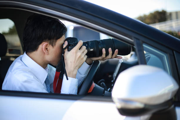 istock A man taking a picture from inside the car 1288759386
