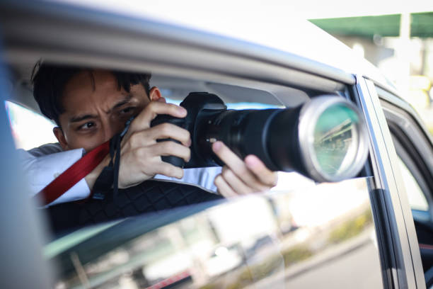 istock A man taking a picture from inside the car 1288759415