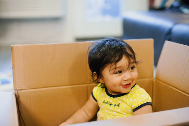istock Quarantine Baby Girl Playing In Cardboard Box Using Her Imagination 1288760185