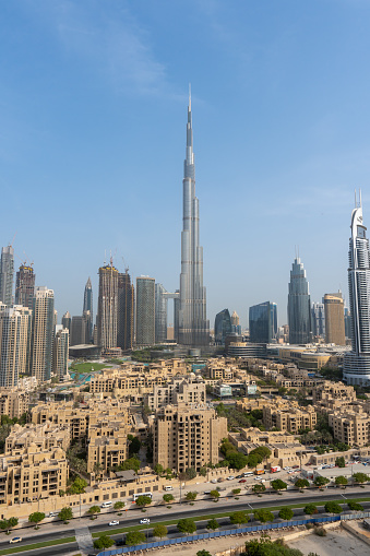 8/11/2020 - Dubai, United Arab Emirates: Iconic portrait shot of Burj Khalifa and Dubai Skyline during the day with and other skyscrapers in the Middle East with blue sky\