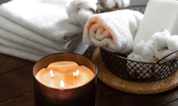 istock Spa composition with burning candles and bath accessories close up. 1288773700