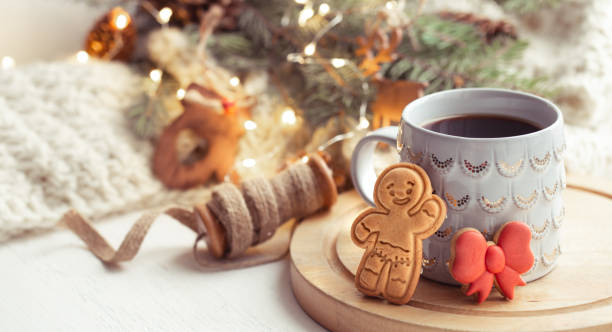 istock Christmas composition with gingerbread boy and beautiful cup with hot drink close up. 1288774549
