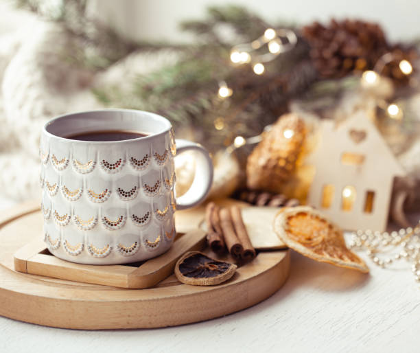 istock Beautiful cup with hot drink close up on blurred background with bokeh lights. 1288774554