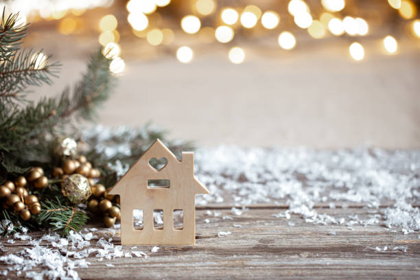 istock Christmas cozy background with decor details, snow and blurry lights copy space. 1288774634