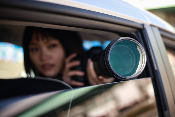 istock Woman taking pictures from inside the car 1288776292