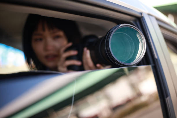 istock Woman taking pictures from inside the car 1288776309