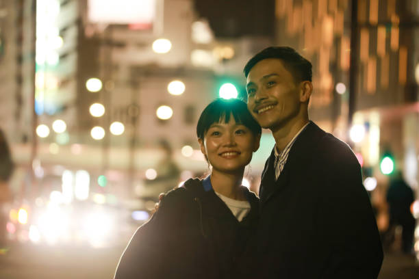 Free Stock Photo of Couple Walking Down City Street at Night | Download ...