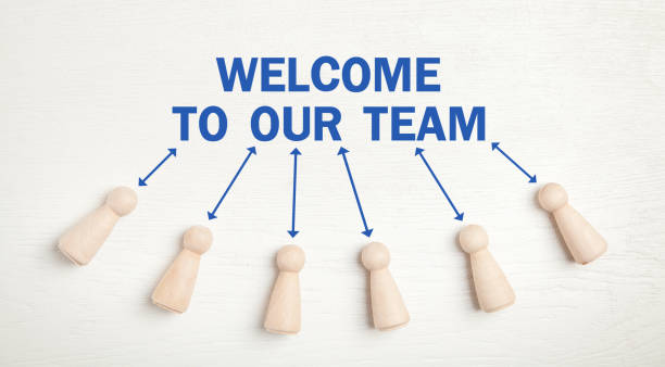istock Welcome To Our Team. Wooden human figures 1288777598