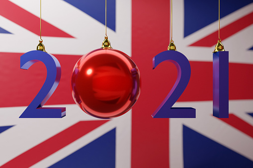 3D illustration  2021 happy new year against the background of the national  flag of United Kingdom, 2021 white letter . Illustration of the symbol of the new year.