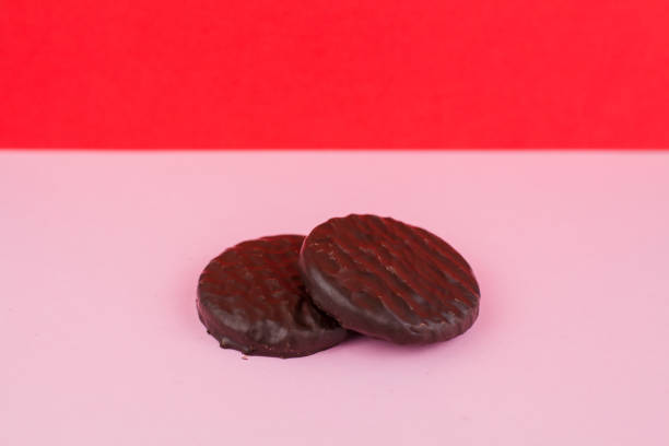istock chocolate chip cookies on a pink background 1288779037