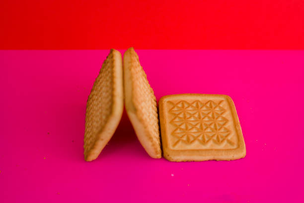 istock square cookies on a pink background on the table 1288779246