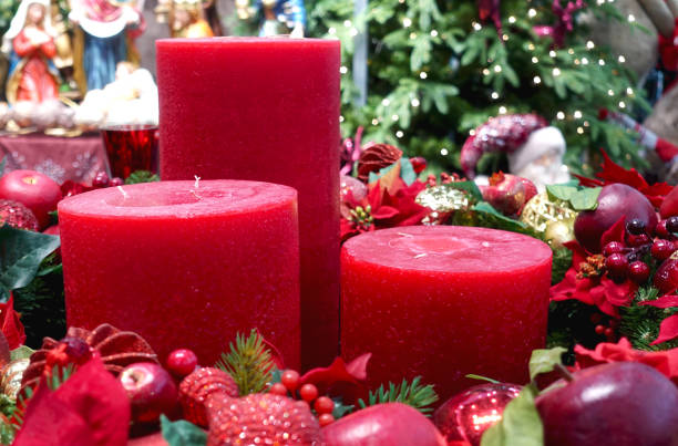 istock Red christmas candles and christmas tree 1288780513