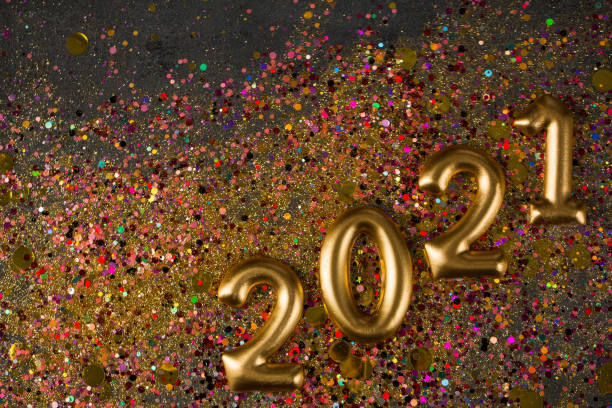 istock 2021 New year greeting card, golden digits in sparkle background 1288782585