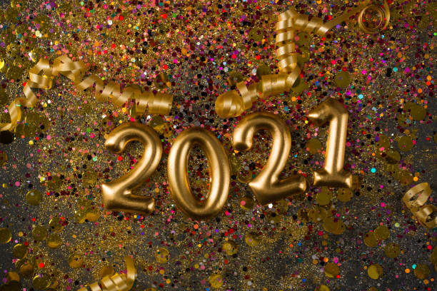 istock 2021 New year greeting card, golden digits in sparkle background 1288782840