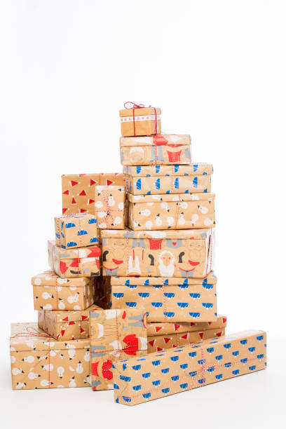 istock Many gifts in wrapped boxes on white background 1288782956