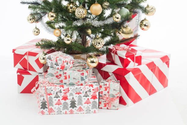 istock Decorated Christmas tree and many wrapped boxes with gifts under it 1288783100