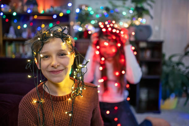 istock Little boy wearing Christmas lights on his head 1288783303