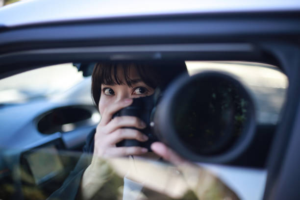 istock Woman taking pictures from inside the car 1288784268