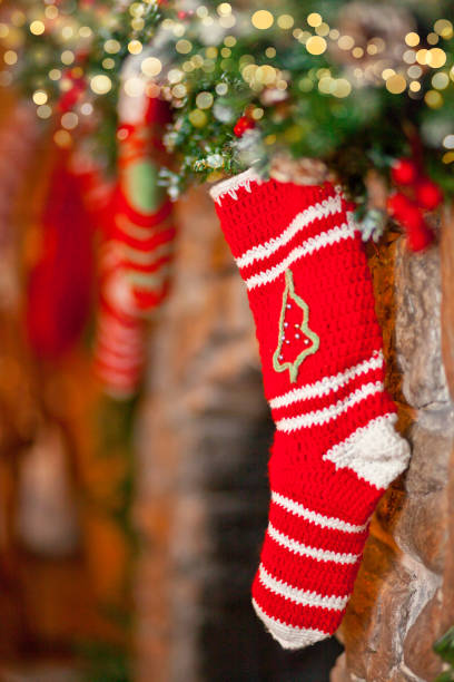istock Christmas red knitted stocks on fireplace background 1288784817