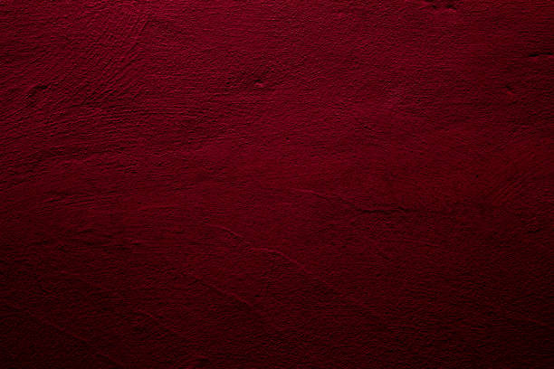 istock Crimson abstract textured wall background in red 1288788710