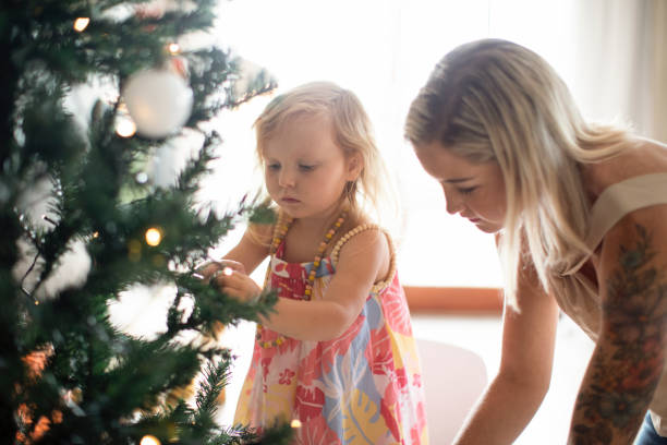 istock A young family setting up their Christmas tree. 1288788810
