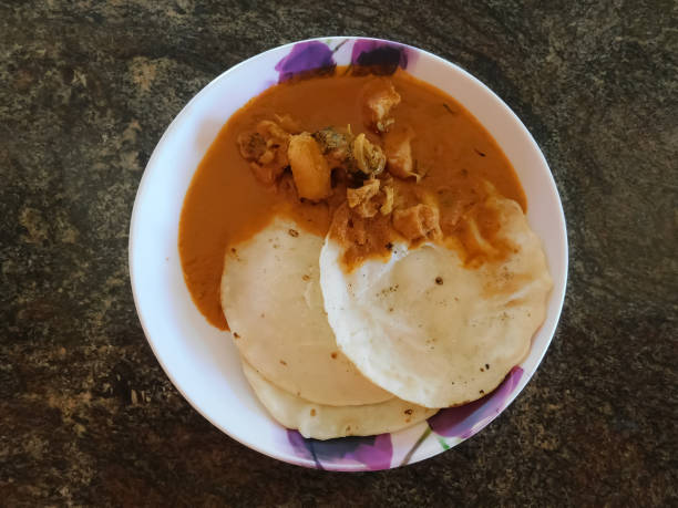istock Appam/Rotti with chicken curry in a bowl 1288791077