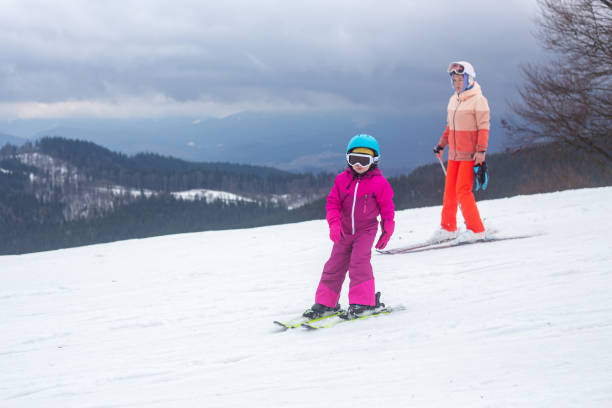 istock The child is skiing with his mother. 1288791107