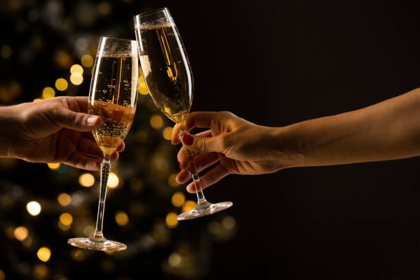 New Year Concept Woman And Man With Champagne Glasses Clinking Photo Image Now - iStock