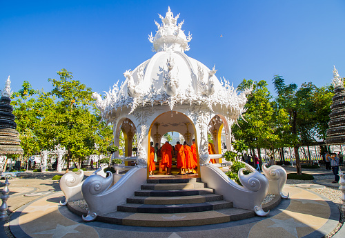 The monks visitting Wat Rong Khun or White Temple in Chiang Rai, Thailand.Wat Rong Khun is one of tourist destination in Chiang Rai.