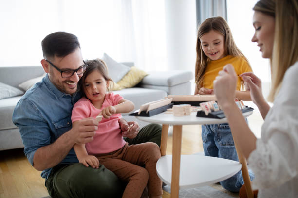 istock Happy family having fun time at home 1288793339