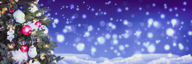 istock Christmas Tree with snow and defocused lights in the night. 1288795268
