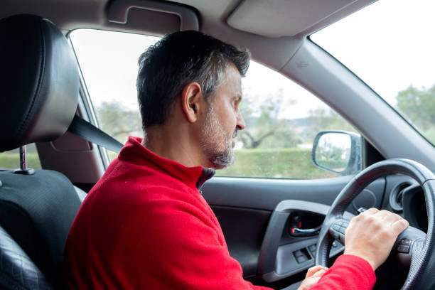 istock Attractive Man Driving A Car 1288798622
